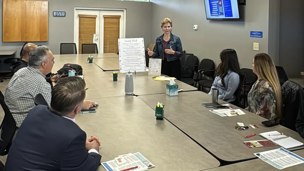 Mona presenting her Nearly Weds content to a small group at San Diego Regional East County Chamber of Commerce conference room